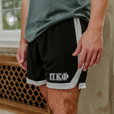 Pi Kapp Greek Fraternity Black 7" Mesh Shorts with Greek letters.