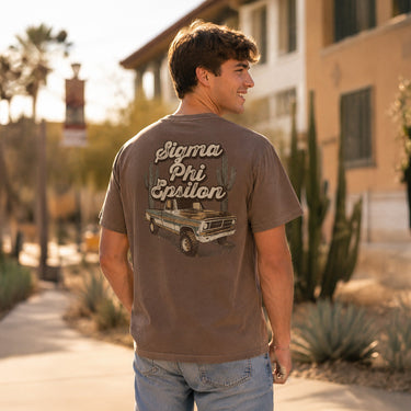 Comfort Colors High Roller Tee shown front and back, featuring a small dice graphic on the chest pocket and a large casino-inspired dice design on the back.