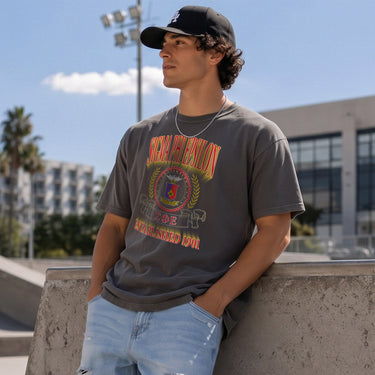 SigEp Collegiate Crest Graphic Tee in charcoal grey featuring bold Sigma Phi Epsilon lettering, fraternity crest, Greek letters, and established year design.