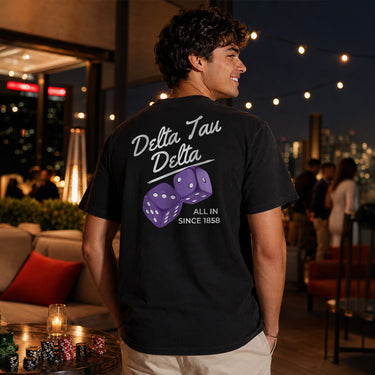 Comfort Colors High Roller Tee shown front and back, featuring a small dice graphic on the chest pocket and a large casino-inspired dice design on the back.