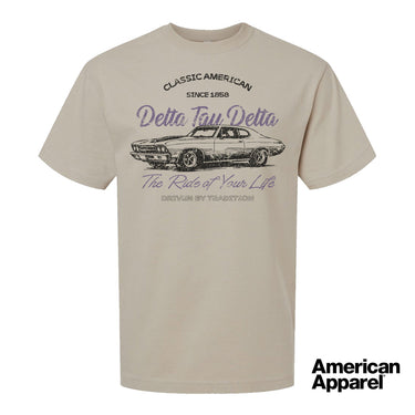 Beige T-shirt displayed on a plain background with a vintage-inspired graphic of a classic muscle car, mixed typography, and a soft red and black print design.