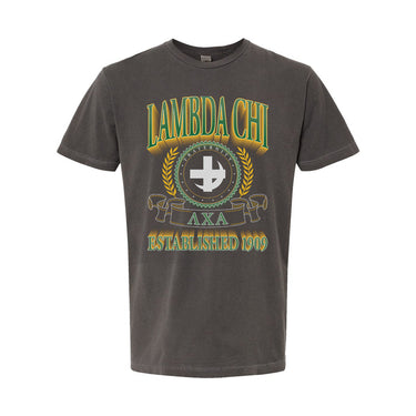 College-aged male wearing the fraternity Collegiate Crest Graphic Tee in charcoal grey, featuring vintage Lambda Chi Alpha crest artwork on campus.