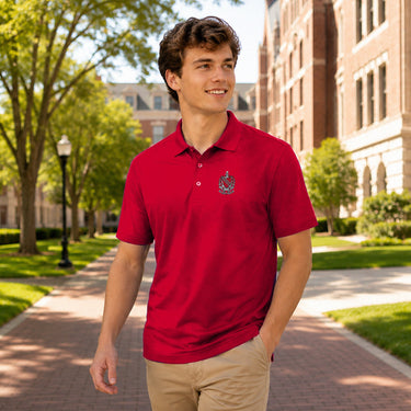 College student wearing fraternity polo embroidered with crest on left chest.