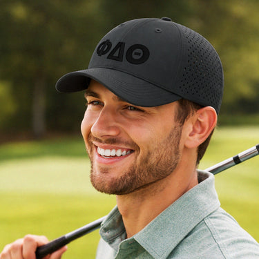 Black fraternity performance hat featuring 3D puff embroidered Greek letters and ventilated panels for a modern athletic look
