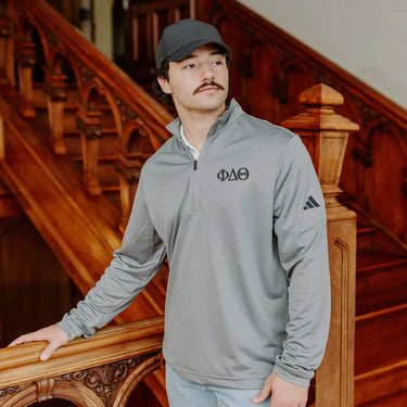 Phi Delta Theta Fraternity Grey Adidas Lightweight Performance 1/4 Zip with Greek letters.