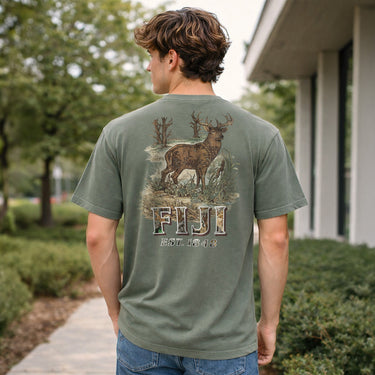 Man wearing a moss green Comfort Colors T-shirt with large woodland deer graphic on the back.