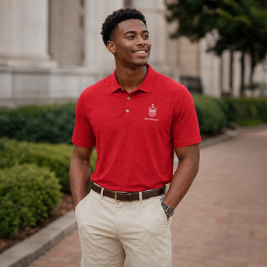 Model wearing a red heathered Cutter & Buck polo with embroidered crest and personalized name detail.