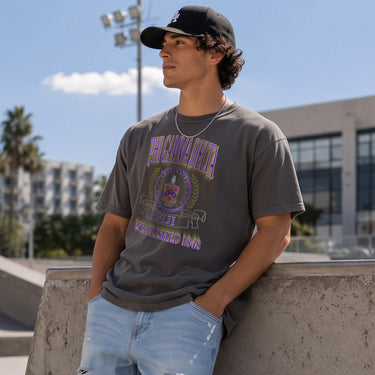 FIJI Collegiate Crest Graphic Tee in charcoal grey featuring bold Phi Gamma Delta lettering, fraternity crest, Greek letters, and established year design.