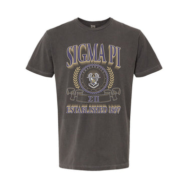 College-aged male wearing the fraternity Collegiate Crest Graphic Tee in charcoal grey, featuring vintage Sigma Pi crest artwork on campus.