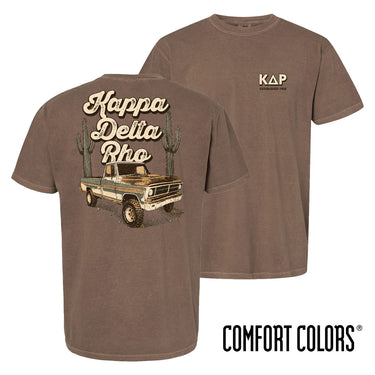 Comfort Colors Desert Highboy Tee shown front and back, featuring a small Kappa Delta Rho chest graphic and a large vintage truck desert design on the back.