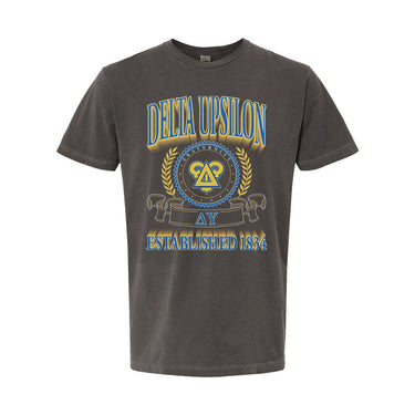 College-aged male wearing the fraternity Collegiate Crest Graphic Tee in charcoal grey, featuring vintage Delta Uspilon crest artwork on campus.