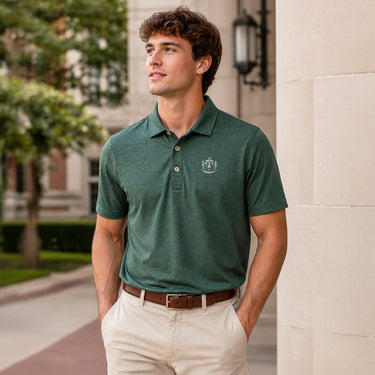 Model wearing a green heathered Cutter & Buck polo with an embroidered crest on the chest.